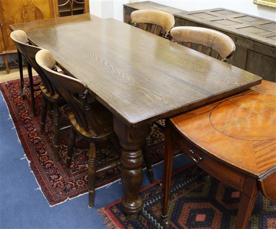An oak kitchen table and four chairs W.152cm